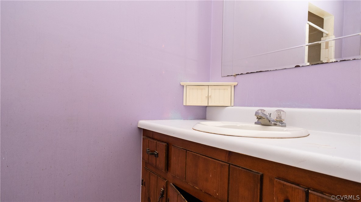 4624 Rabbit Foot Lane Chesterfield, VA 23236 - Photo 18 of 27 a bathroom with a sink a mirror and a toilet