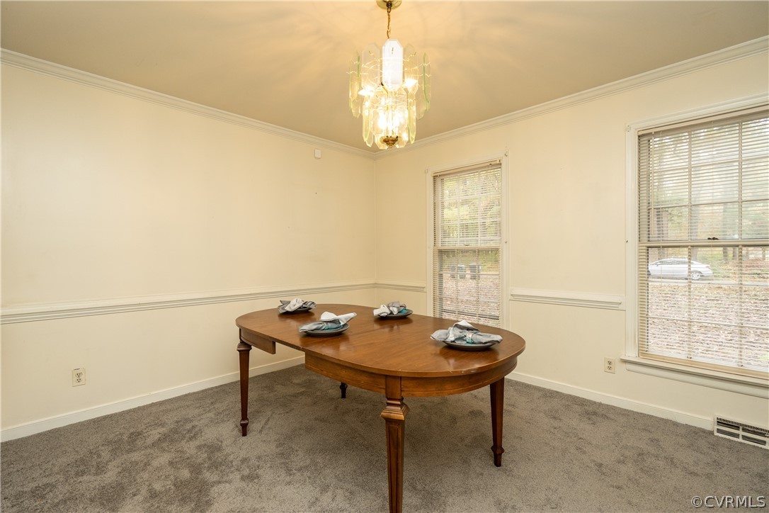4624 Rabbit Foot Lane Chesterfield, VA 23236 - Photo 7 of 27 a dining room with chandelier and a table