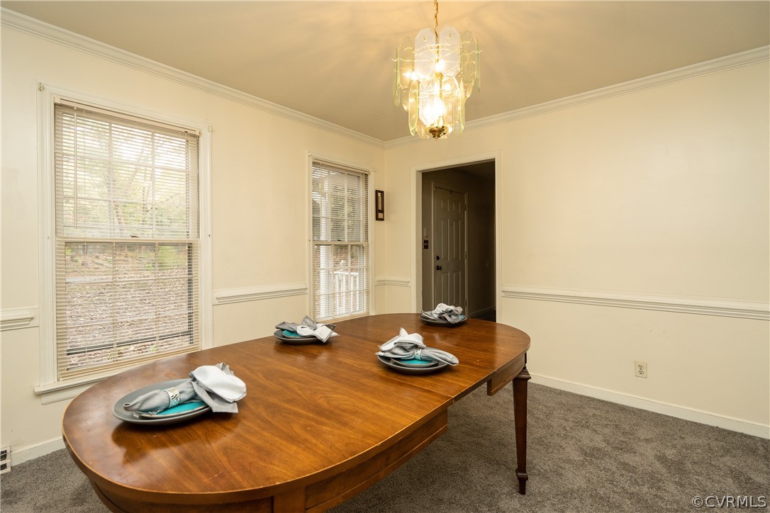 4624 Rabbit Foot Lane Chesterfield, VA 23236 - Photo 8 of 27 a view of a dining room with furniture and a chandelier