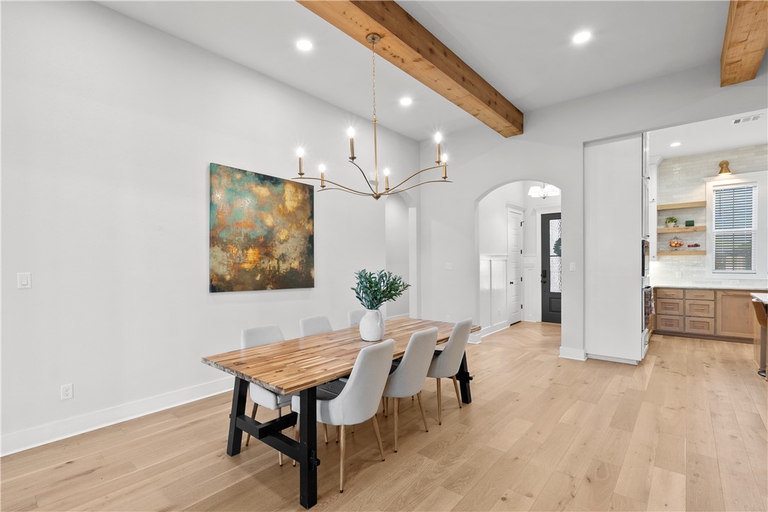 5001 Greenstone Way Bryan, TX 77802 - Photo 11 of 43 a workspace with furniture and wooden floor