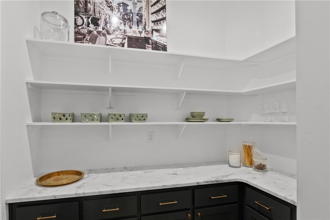 5001 Greenstone Way Bryan, TX 77802 - Photo 18 of 43 a view of cabinets a sink and wooden floor