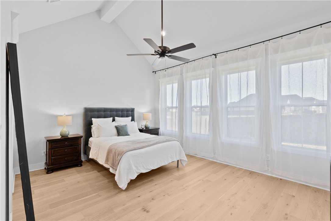 5001 Greenstone Way Bryan, TX 77802 - Photo 19 of 43 a bedroom with a beds chandelier and a window