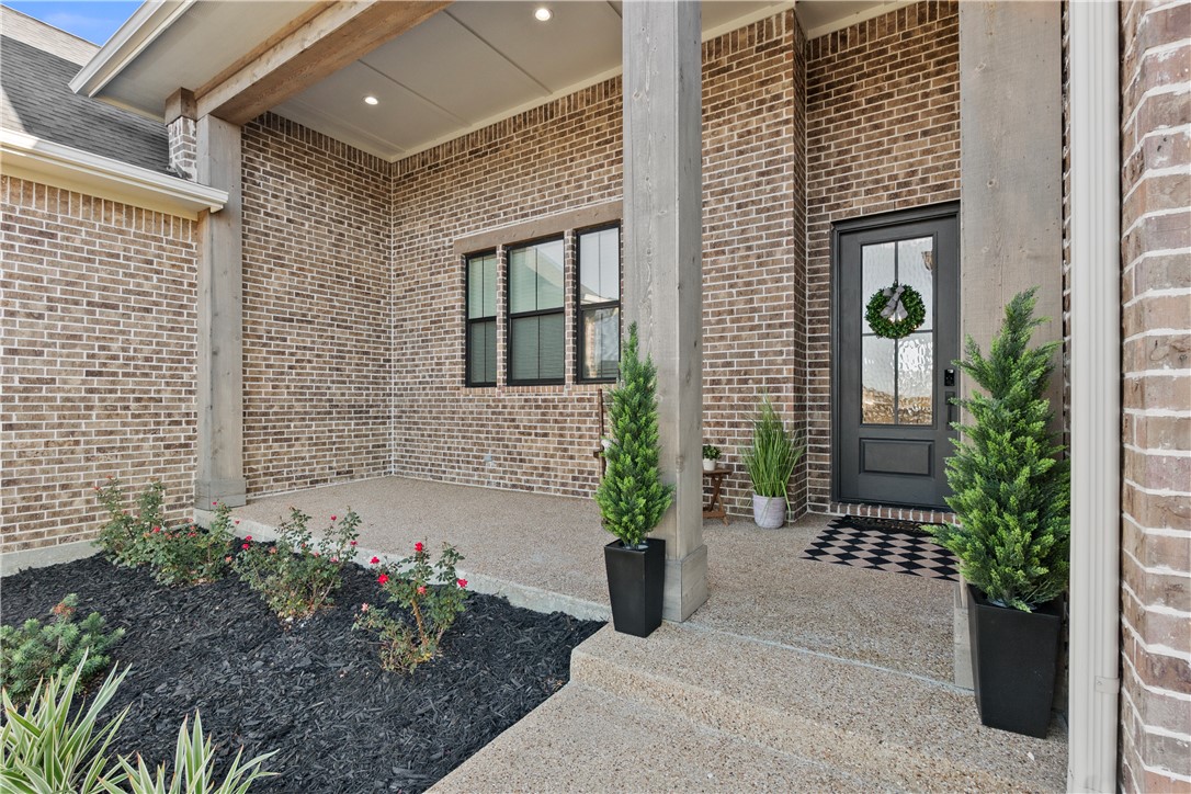 5001 Greenstone Way Bryan, TX 77802 - Photo 2 of 43 a front view of a house with a garden