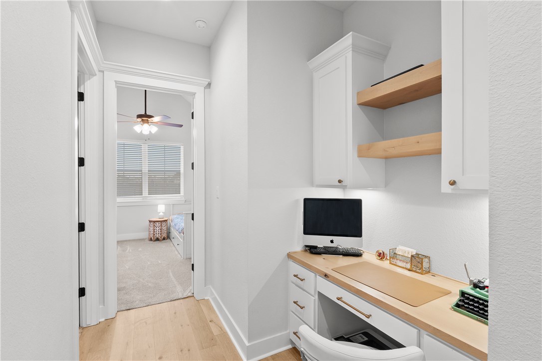 5001 Greenstone Way Bryan, TX 77802 - Photo 30 of 43 a room with a bed and a flat screen tv