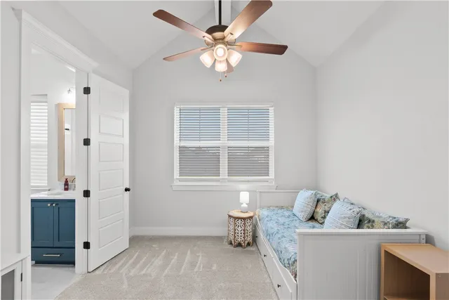 a room with a bed and a flat screen tv