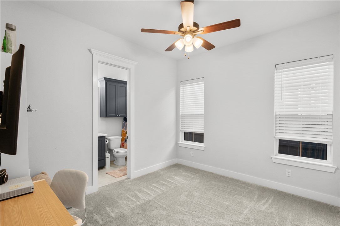 5001 Greenstone Way Bryan, TX 77802 - Photo 33 of 43 a view of livingroom with furniture workspace and a window