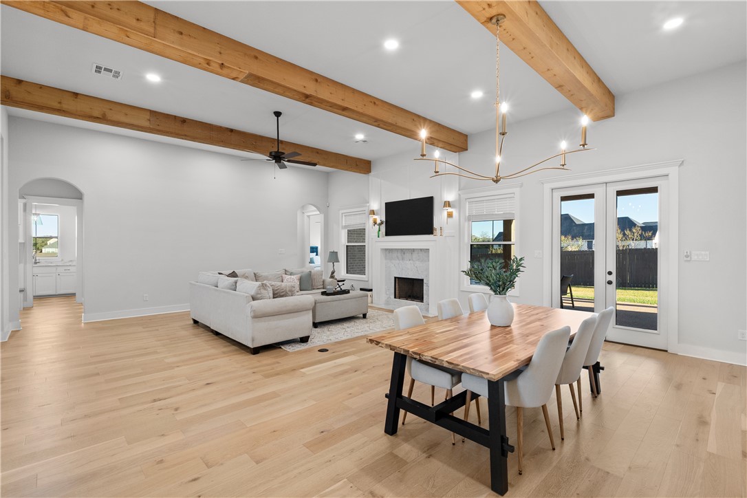 5001 Greenstone Way Bryan, TX 77802 - Photo 5 of 43 a living room with furniture and a fireplace