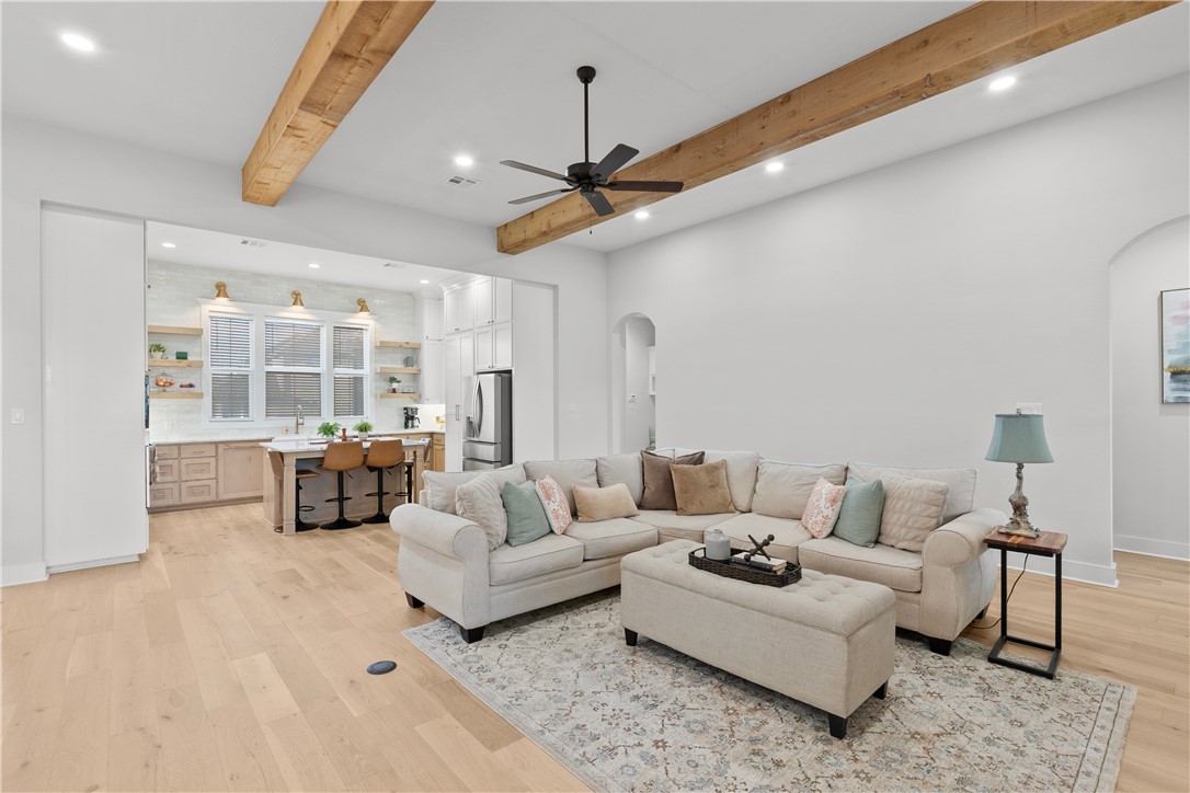 5001 Greenstone Way Bryan, TX 77802 - Photo 9 of 43 a living room with furniture and a chandelier