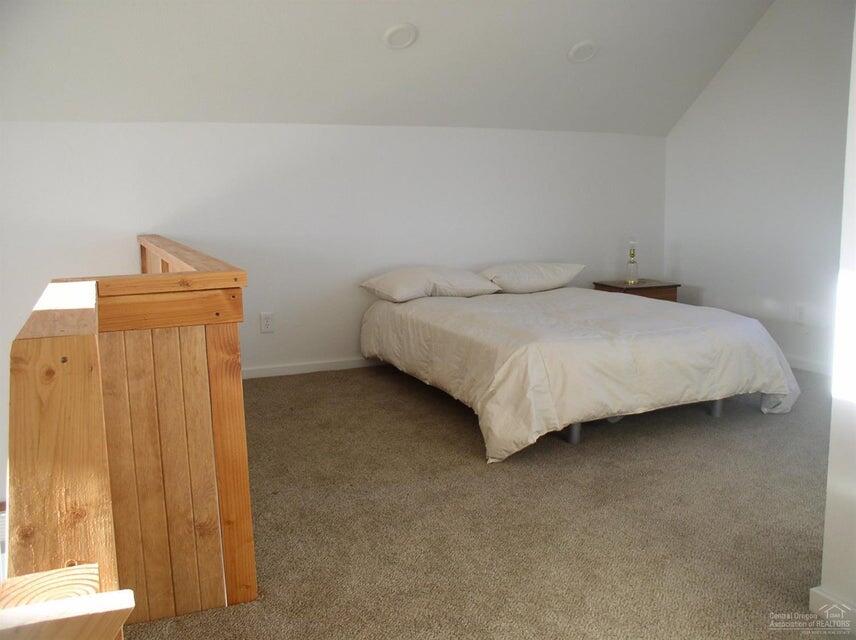 57655 Fall Road Christmas Valley, OR 97641 - Photo 13 of 25 a bed sitting in a room next to a window