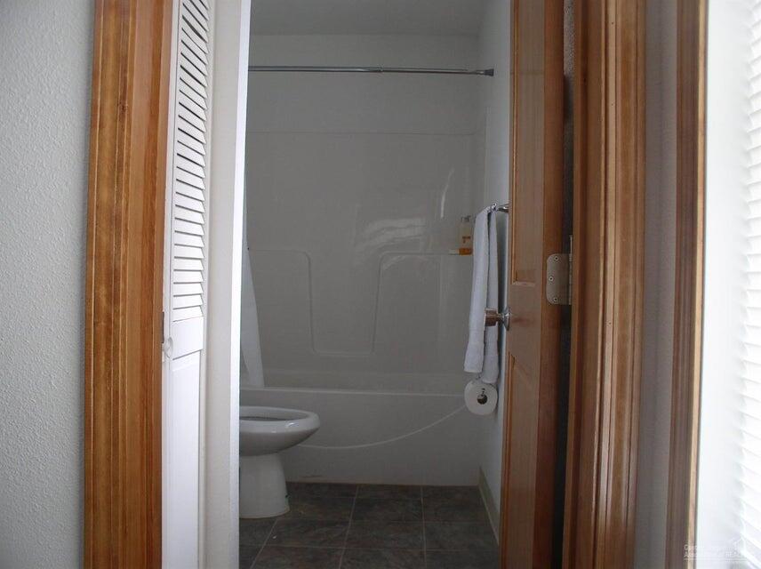 57655 Fall Road Christmas Valley, OR 97641 - Photo 14 of 25 a bathroom with a bathtub and a shower