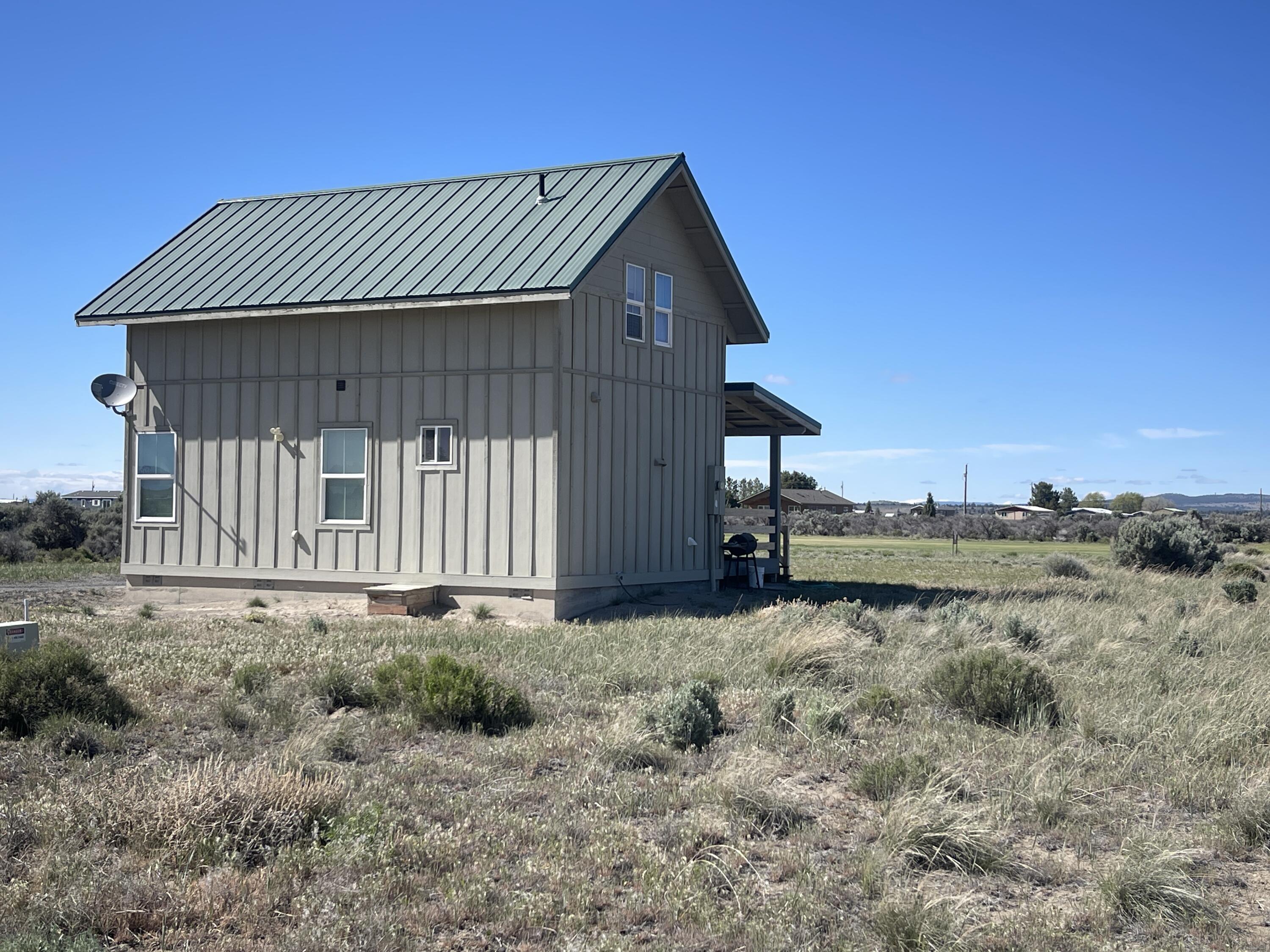 57655 Fall Road Christmas Valley, OR 97641 - Photo 17 of 25 a view of a house with a yard