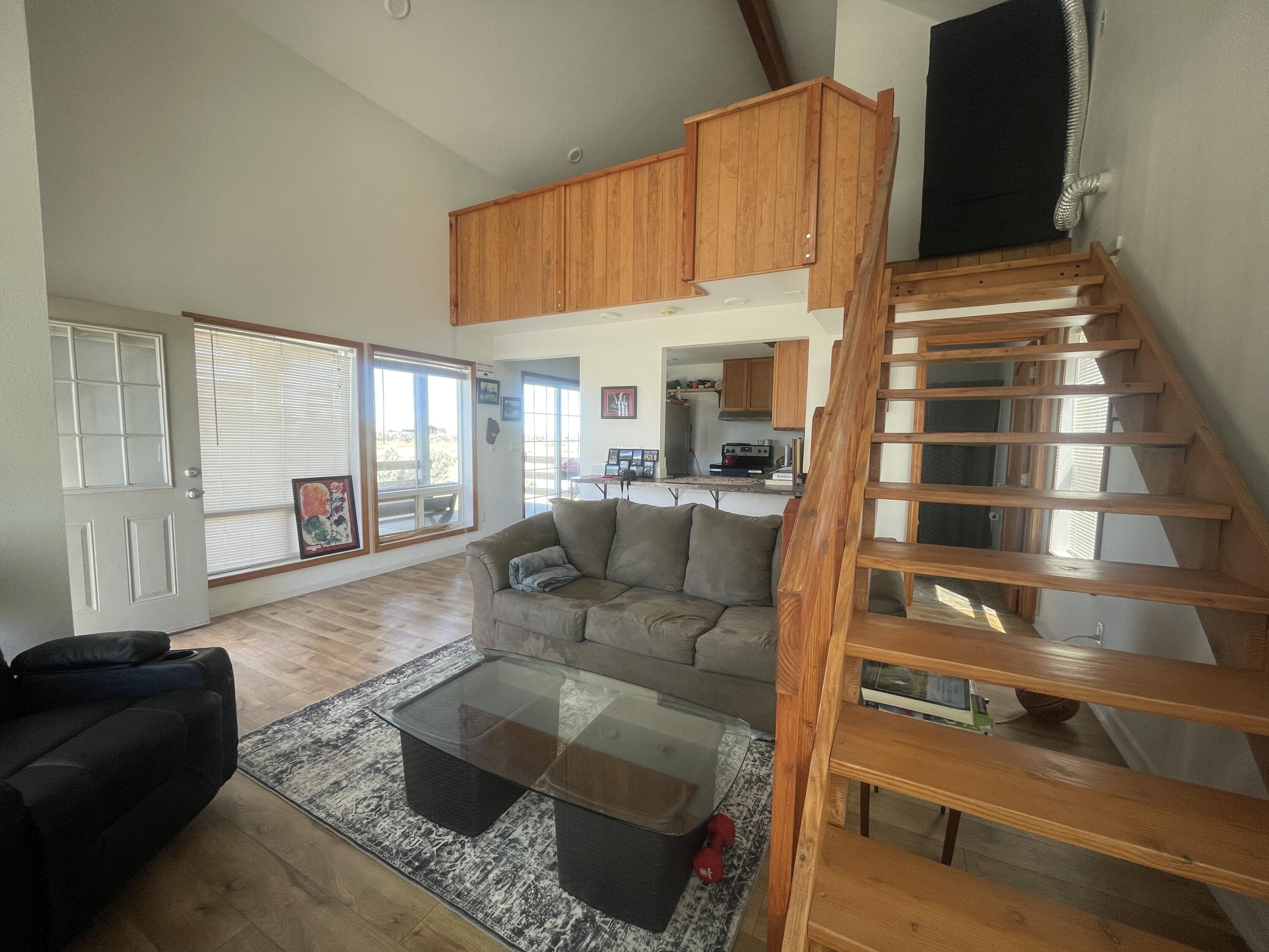 57655 Fall Road Christmas Valley, OR 97641 - Photo 6 of 25 a living room with furniture and a large window