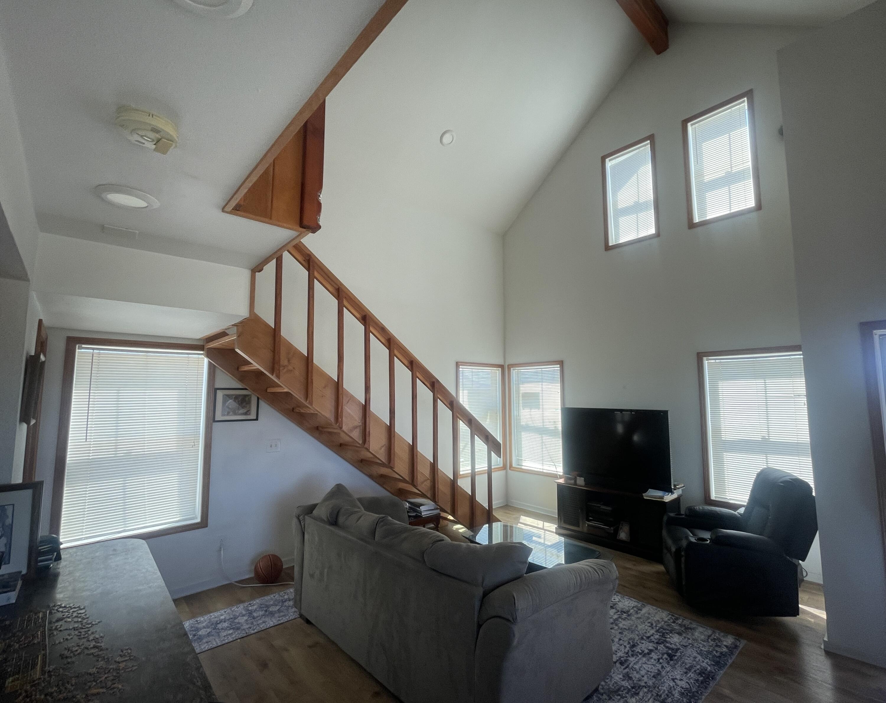 57655 Fall Road Christmas Valley, OR 97641 - Photo 7 of 25 a living room with furniture a flat screen tv and a fireplace