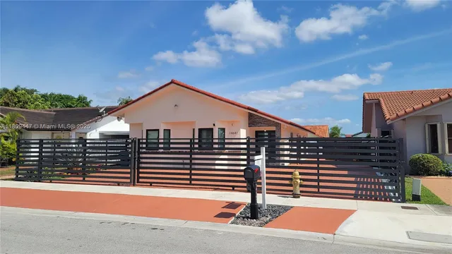 a view of a house with a street