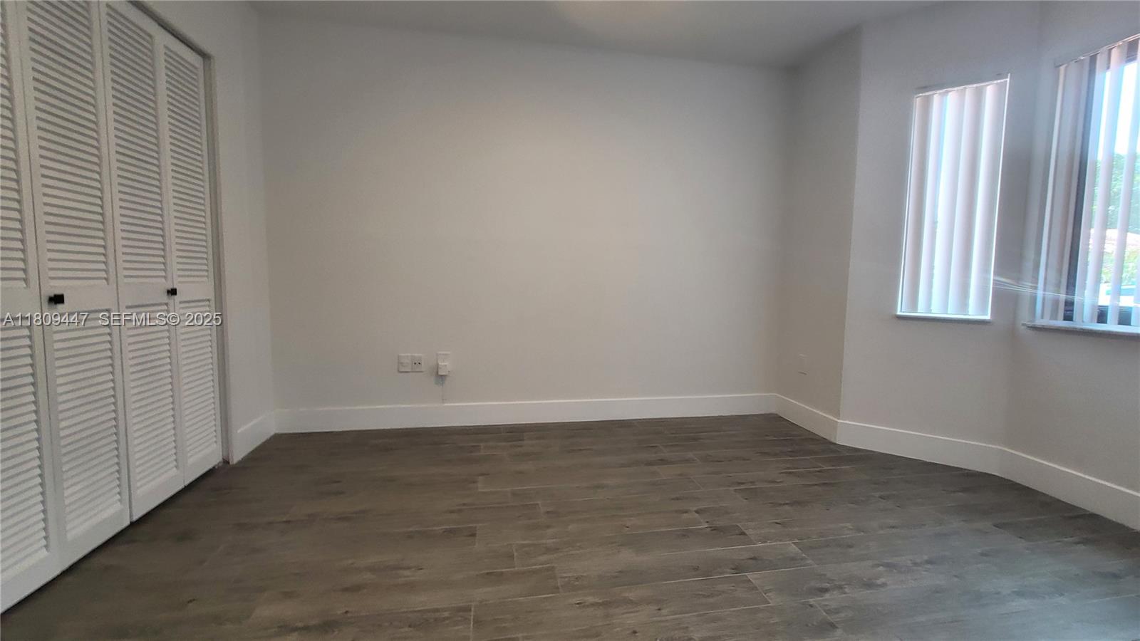 14641 Southwest 52nd Street Miami, FL 33175 - Photo 15 of 26 wooden floor in an empty room