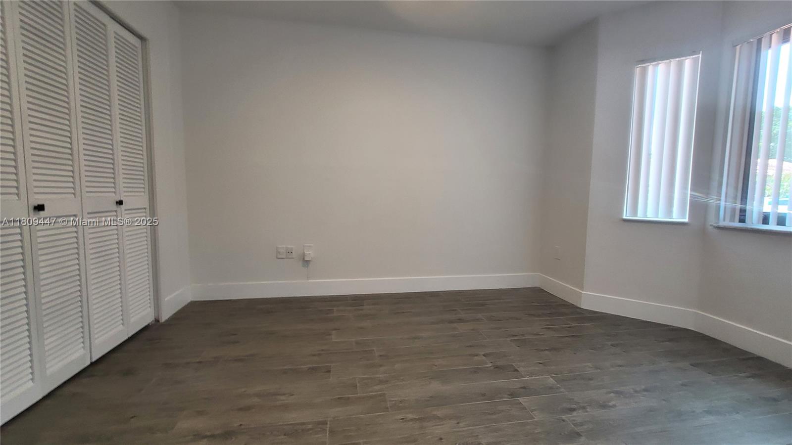 14641 Southwest 52nd Street Miami, FL 33175 - Photo 15 of 26 wooden floor in an empty room