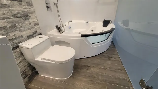 a bathroom with a sink and toilet