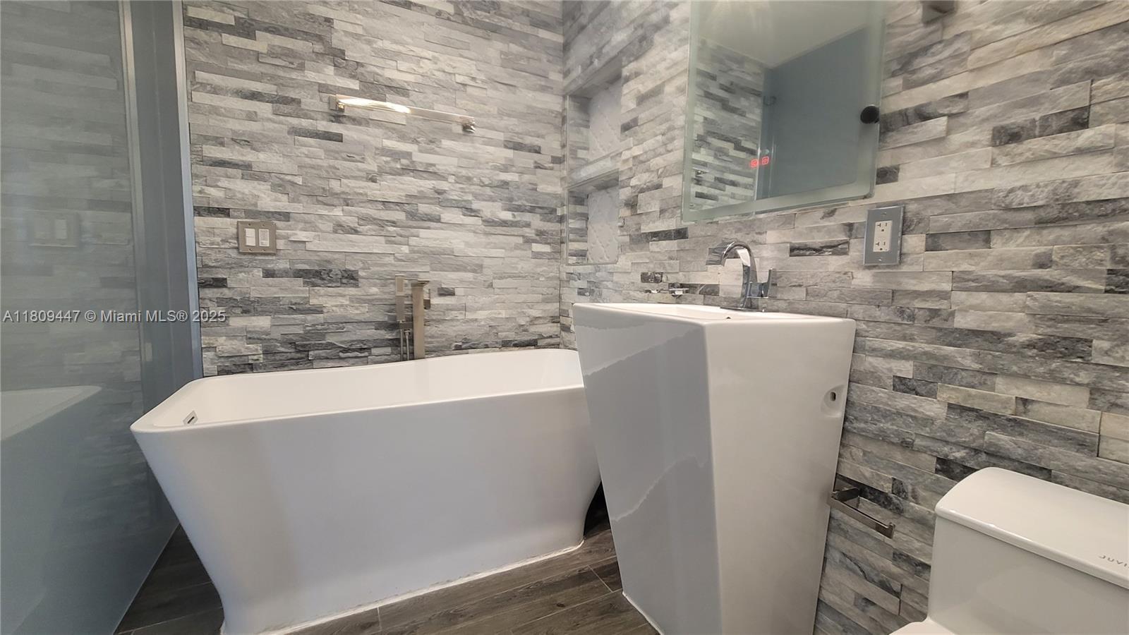 14641 Southwest 52nd Street Miami, FL 33175 - Photo 18 of 26 a bathroom with a sink and a toilet