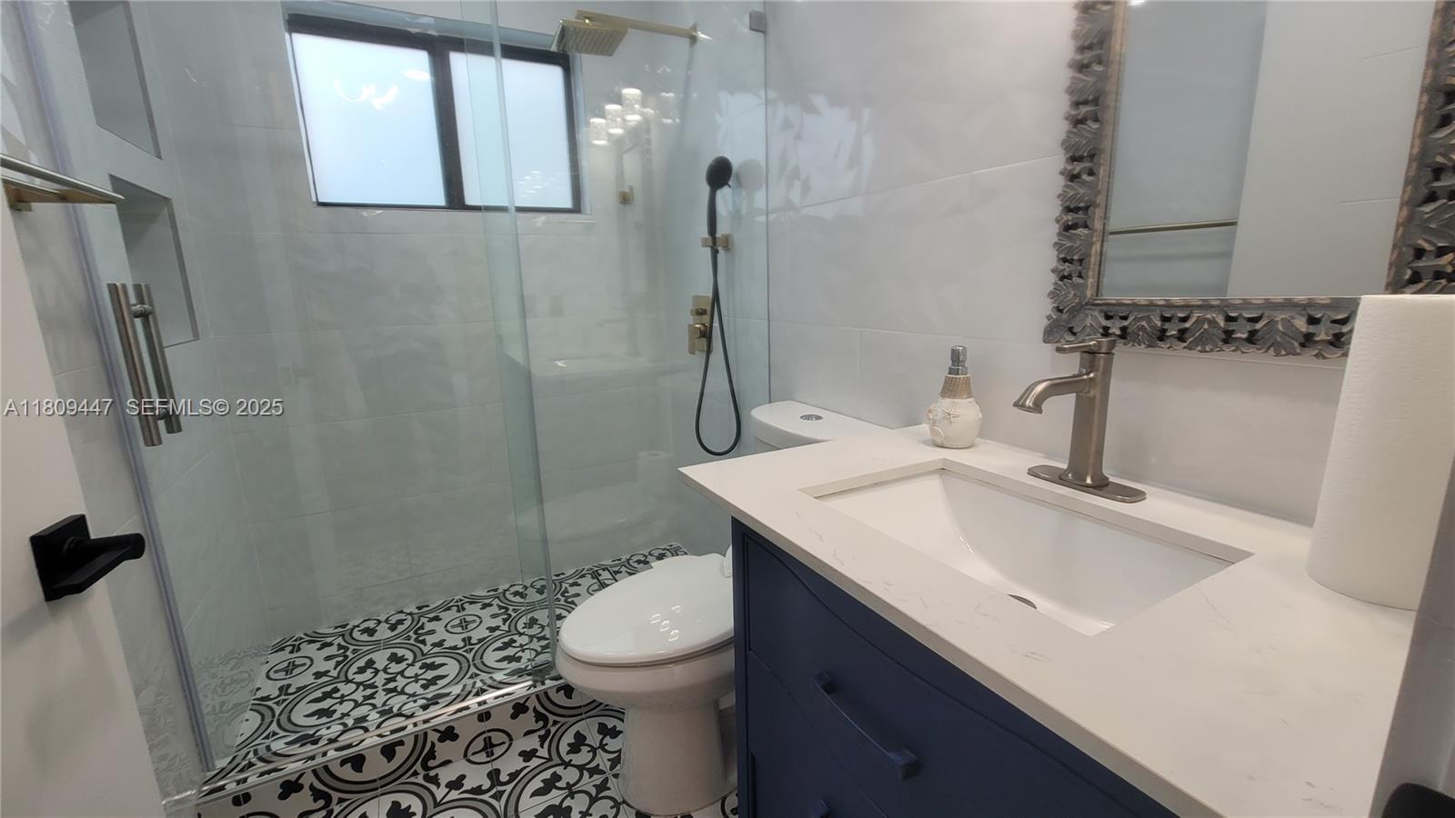14641 Southwest 52nd Street Miami, FL 33175 - Photo 20 of 26 a bathroom with a sink toilet and shower