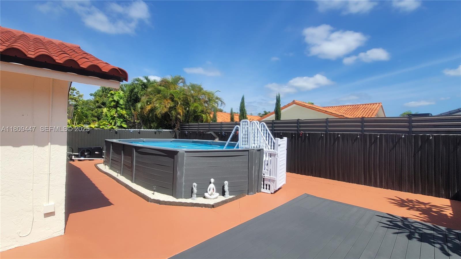 14641 Southwest 52nd Street Miami, FL 33175 - Photo 4 of 26 a view of a couches on the roof deck