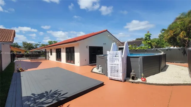 a backyard of a house with seating space