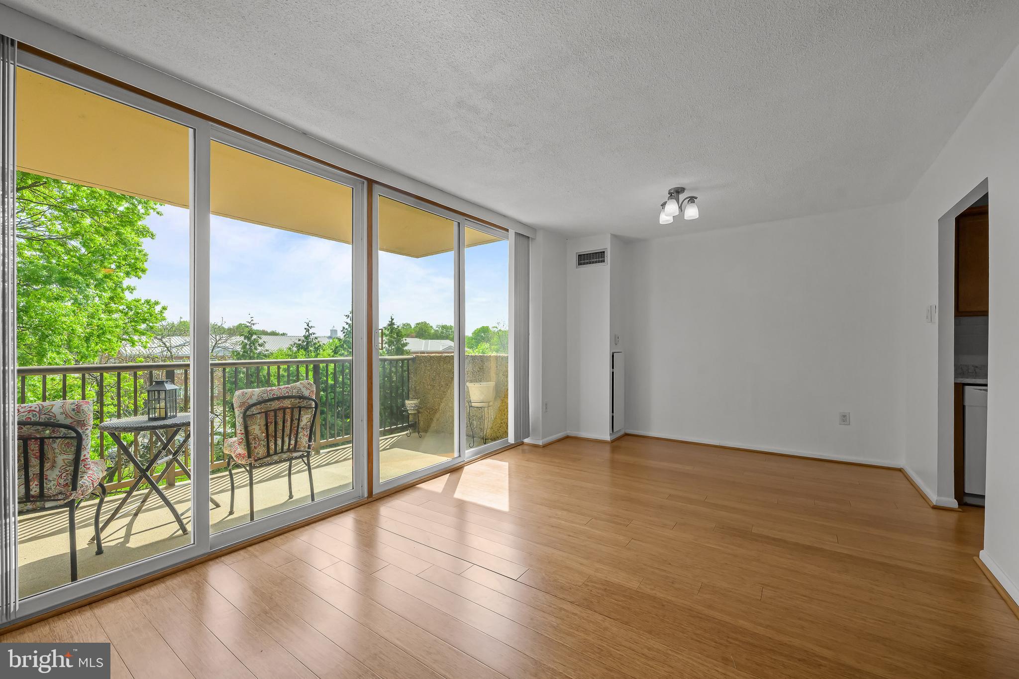 2016 Naamans Road, Unit 5E Wilmington, DE 19810 - Photo 12 of 24 a view of an empty room and wooden floor and fence