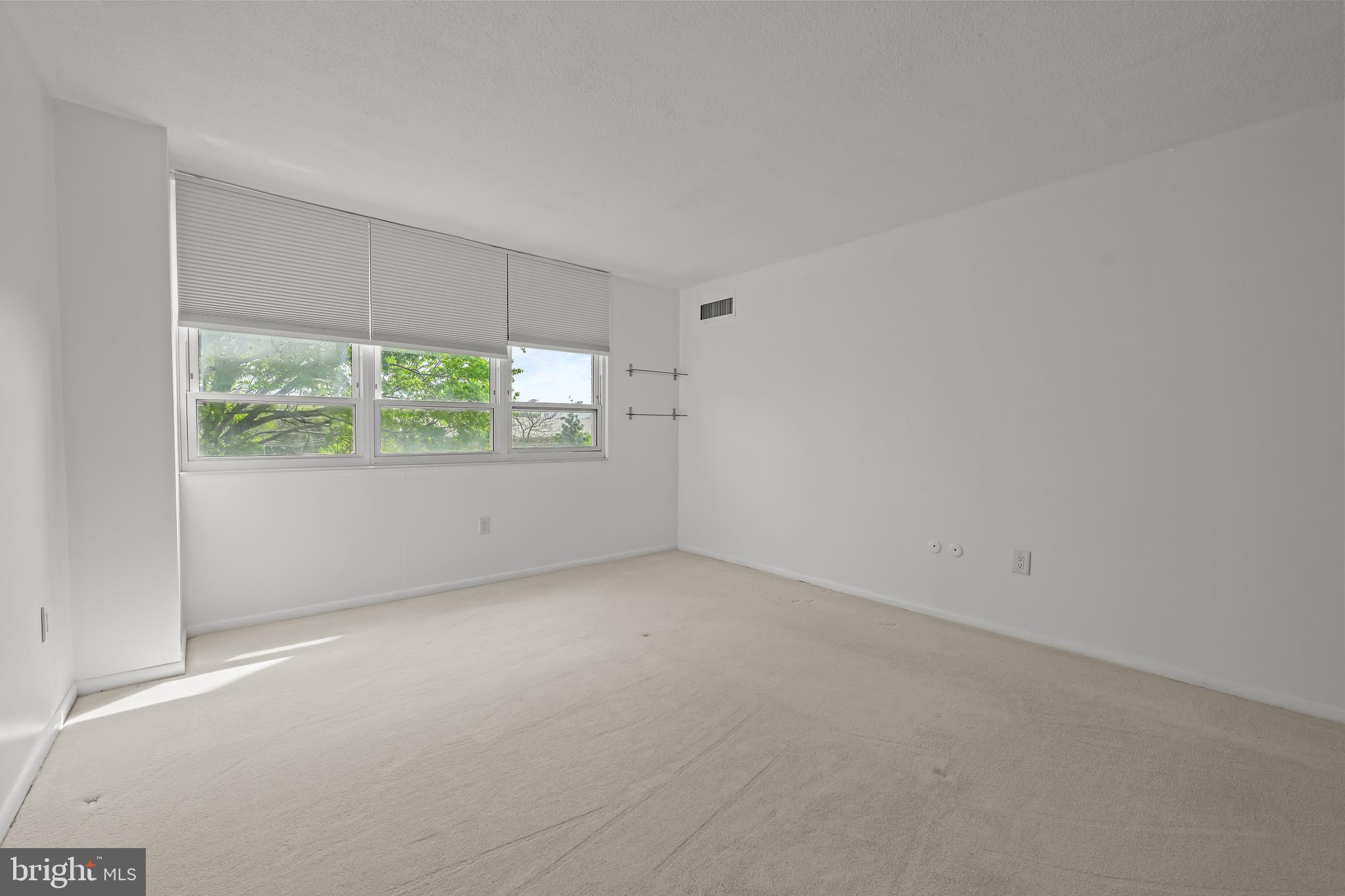 2016 Naamans Road, Unit 5E Wilmington, DE 19810 - Photo 16 of 24 an empty room with windows