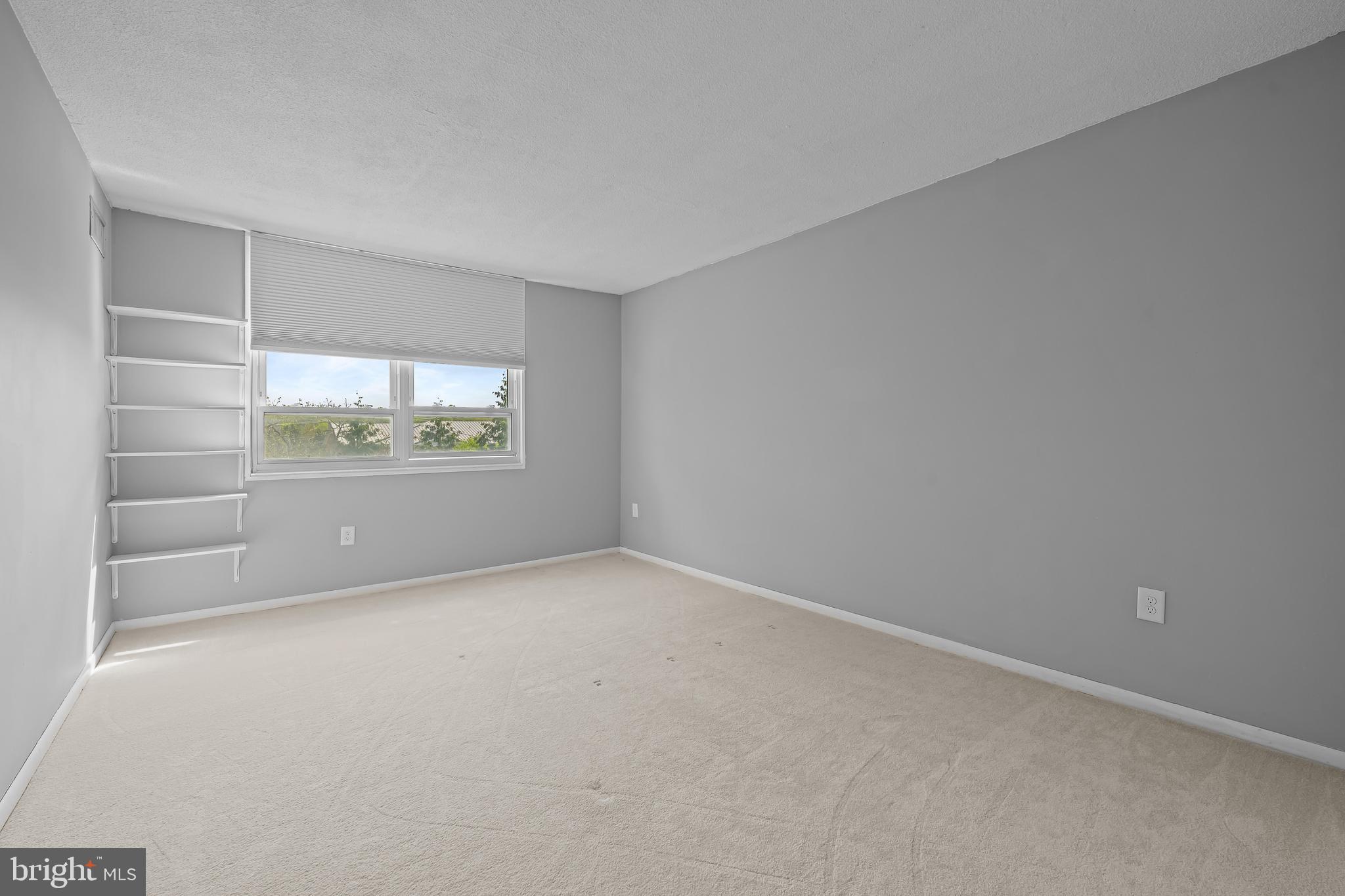 2016 Naamans Road, Unit 5E Wilmington, DE 19810 - Photo 19 of 24 a view of an empty room with a window