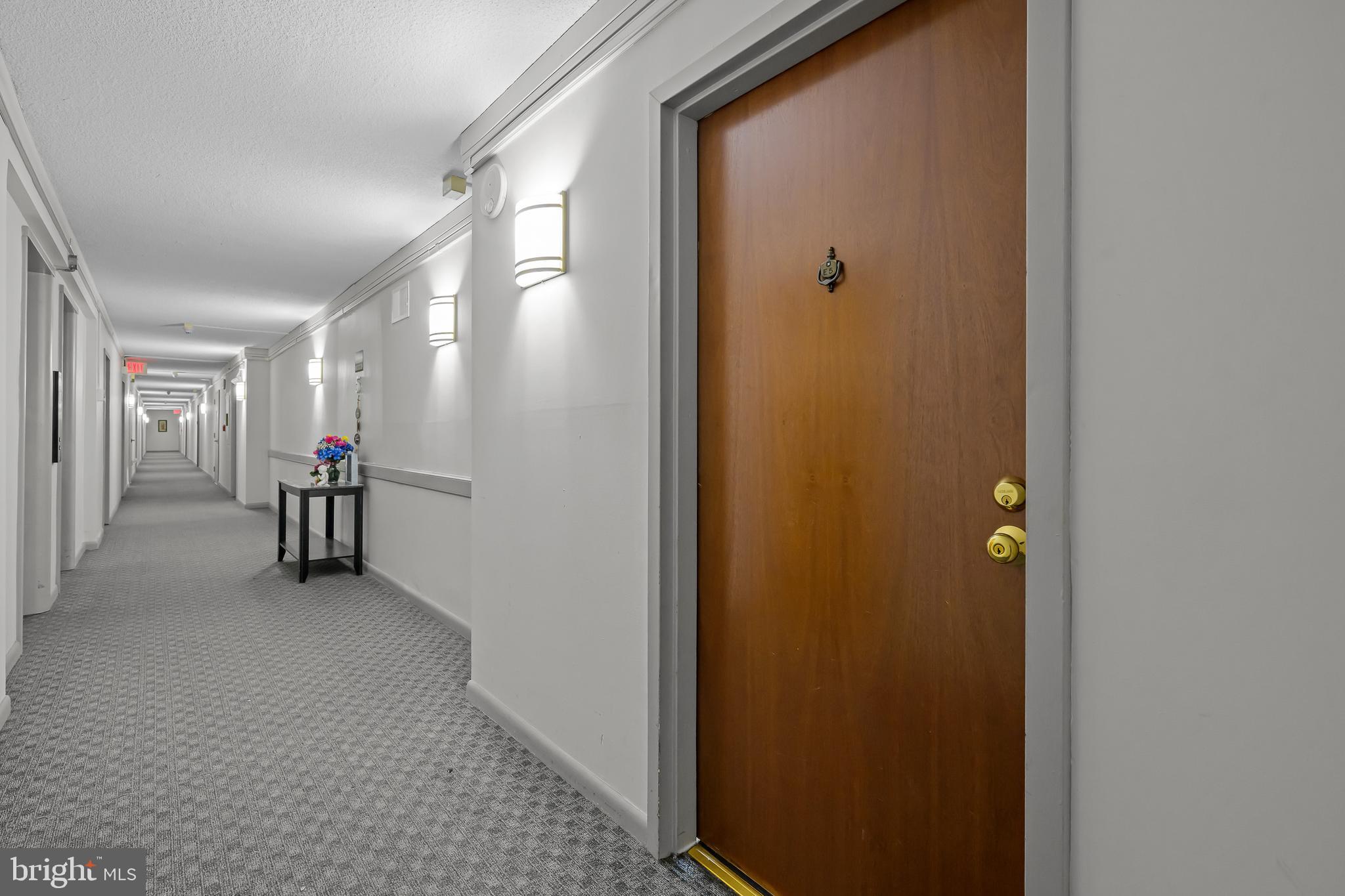 2016 Naamans Road, Unit 5E Wilmington, DE 19810 - Photo 7 of 24 a view of a hallway with wooden shelves
