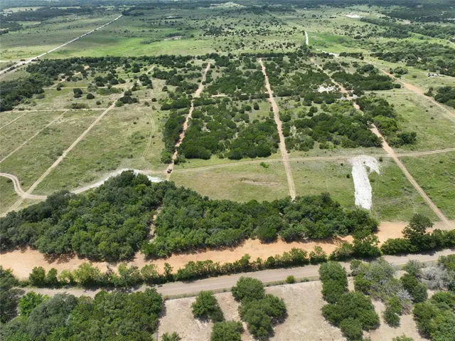 a view of a field with an ocean