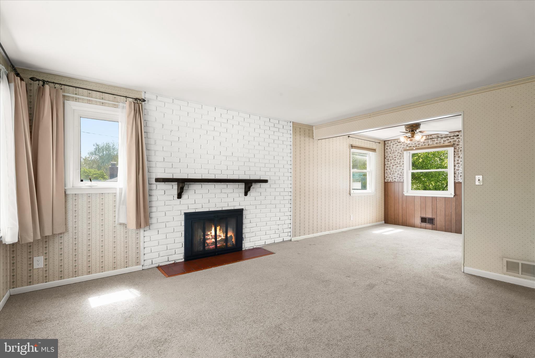 5810 Ritchie Street Glen Burnie, MD 21061 - Photo 11 of 55 an empty room with windows and fireplace