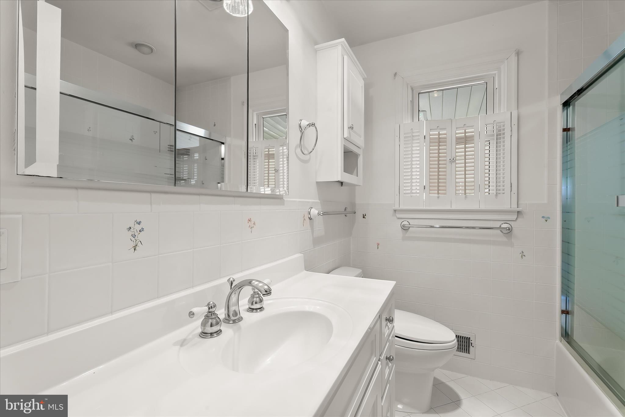 5810 Ritchie Street Glen Burnie, MD 21061 - Photo 22 of 55 a bathroom with a sink a toilet and shower