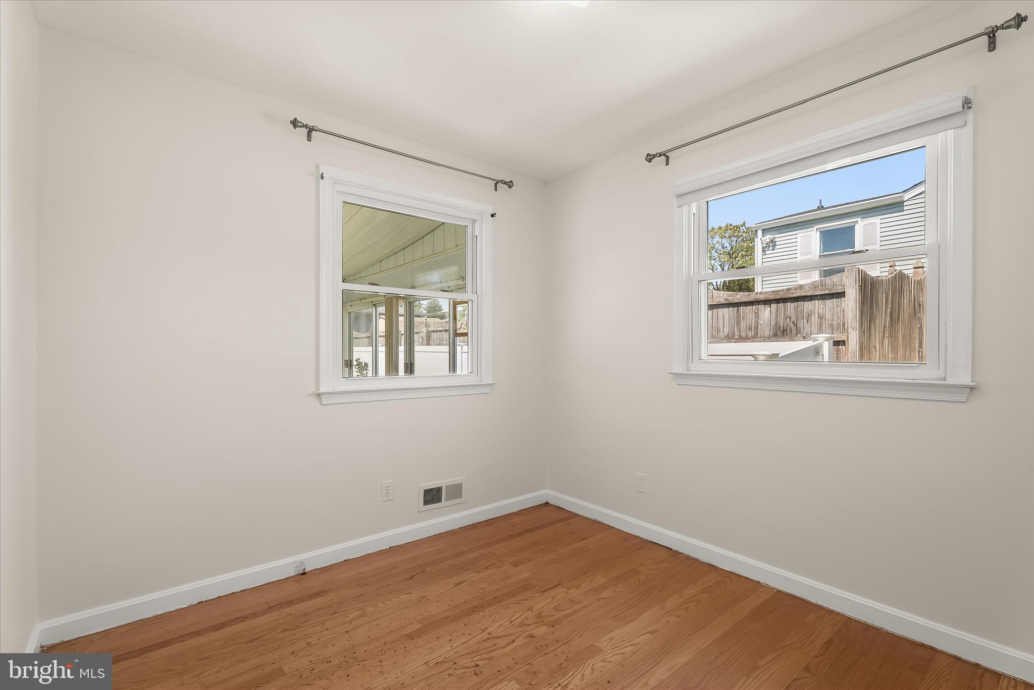 5810 Ritchie Street Glen Burnie, MD 21061 - Photo 24 of 55 a view of an empty room with wooden floor and a window