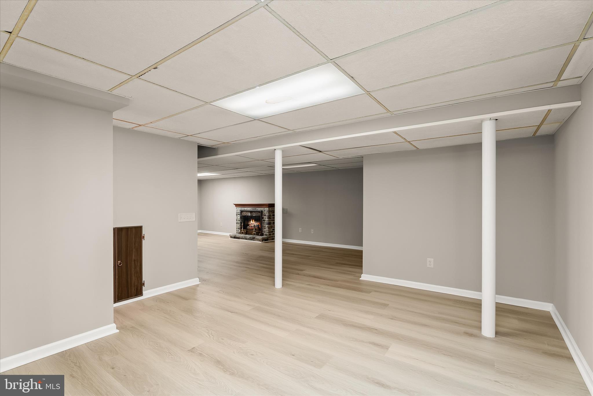 5810 Ritchie Street Glen Burnie, MD 21061 - Photo 36 of 55 a view of a room with wooden floor and a ceiling fan