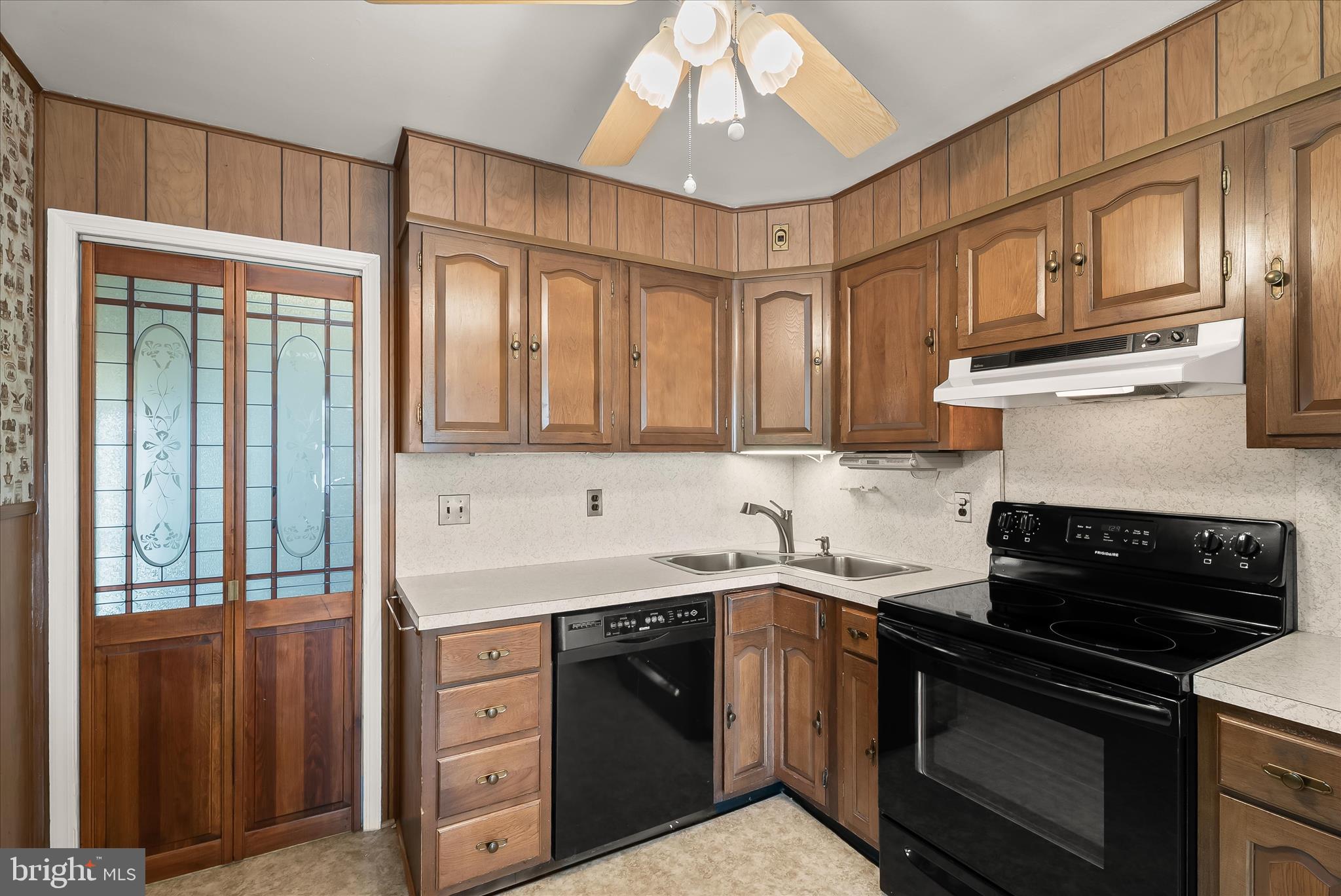 5810 Ritchie Street Glen Burnie, MD 21061 - Photo 4 of 55 a kitchen with stainless steel appliances granite countertop a sink stove and cabinets