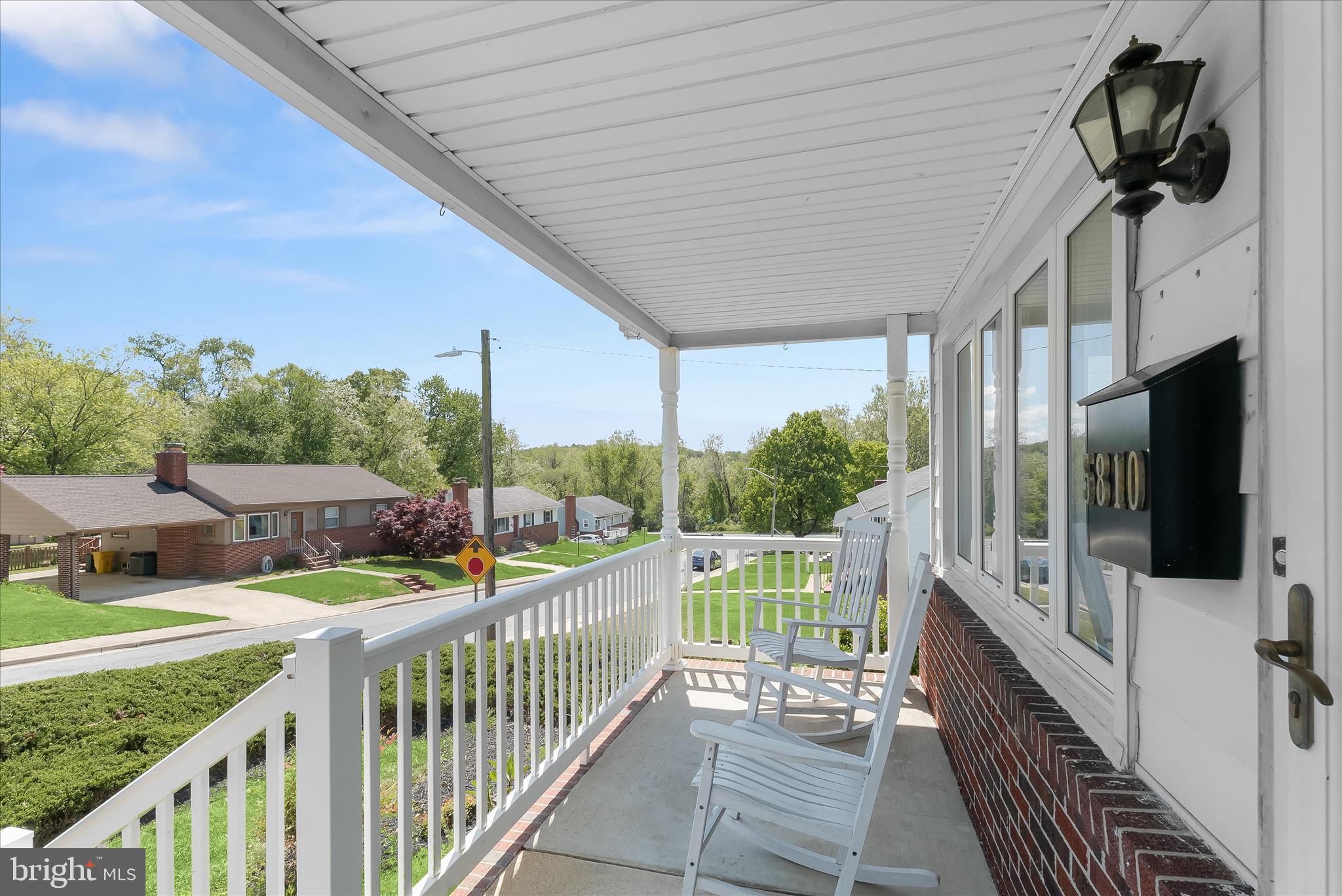 5810 Ritchie Street Glen Burnie, MD 21061 - Photo 43 of 55 a view of a porch with wooden floor and iron fence