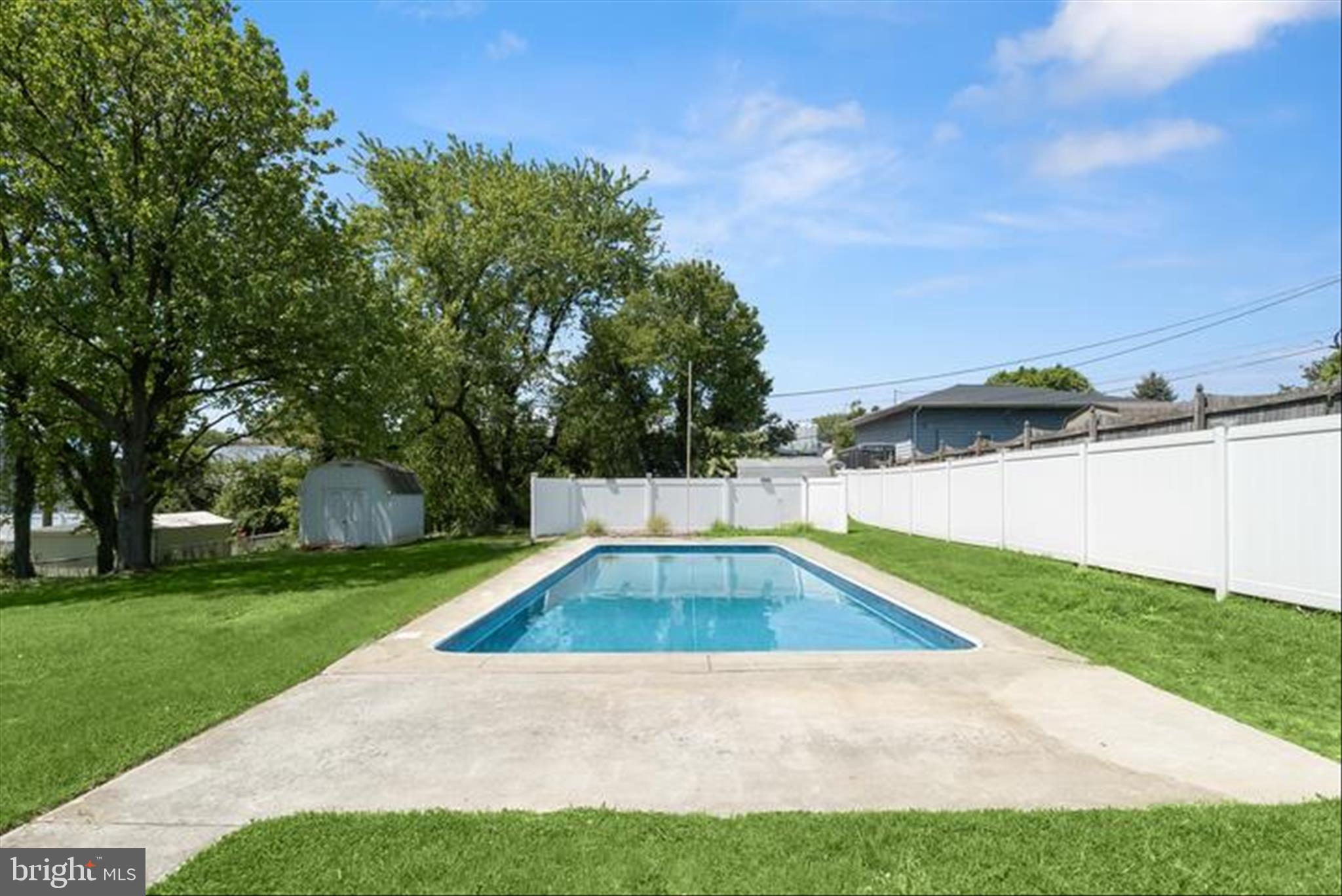 5810 Ritchie Street Glen Burnie, MD 21061 - Photo 45 of 55 a view of backyard with swimming pool and green space