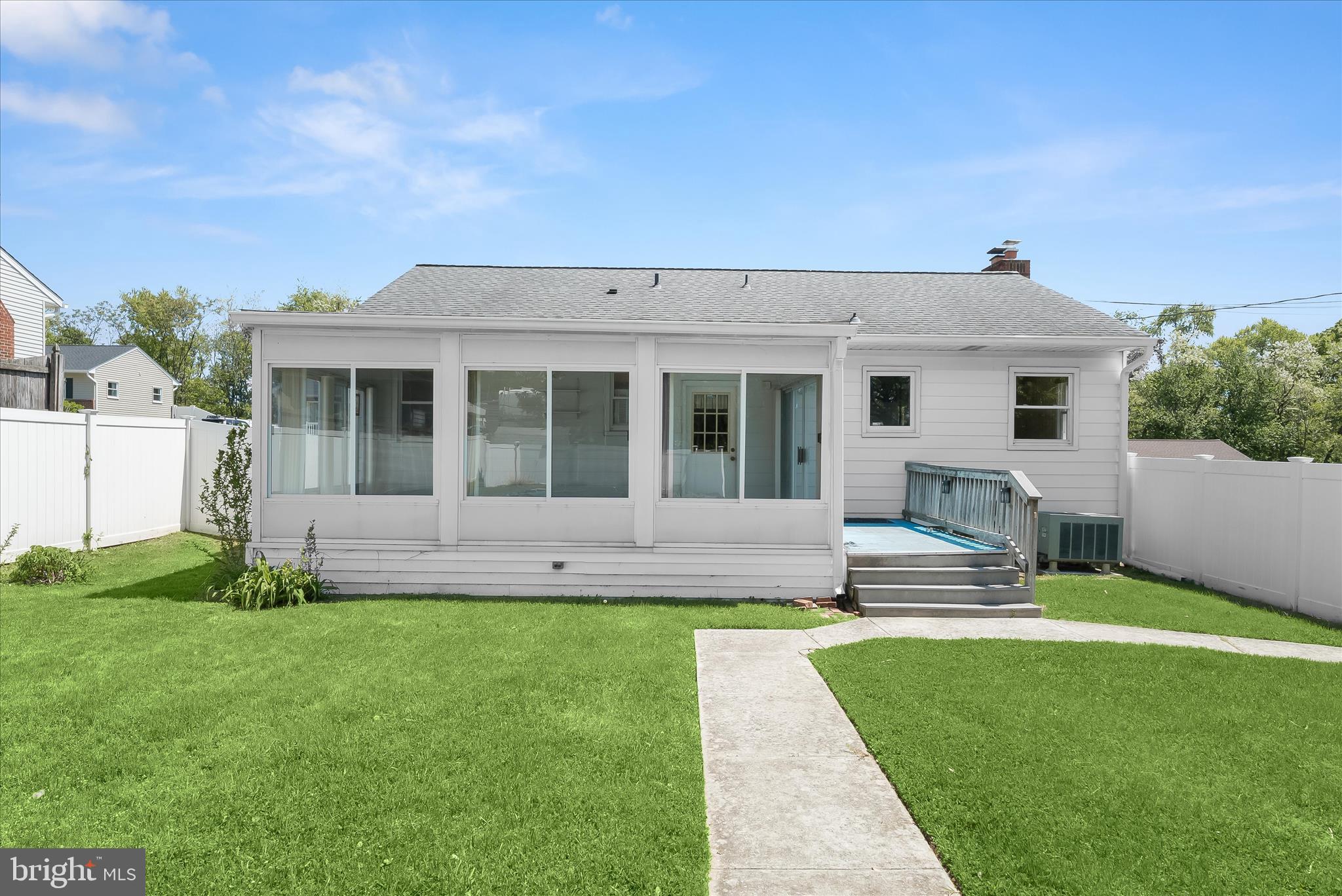 5810 Ritchie Street Glen Burnie, MD 21061 - Photo 49 of 55 a view of a house with a yard and sitting area