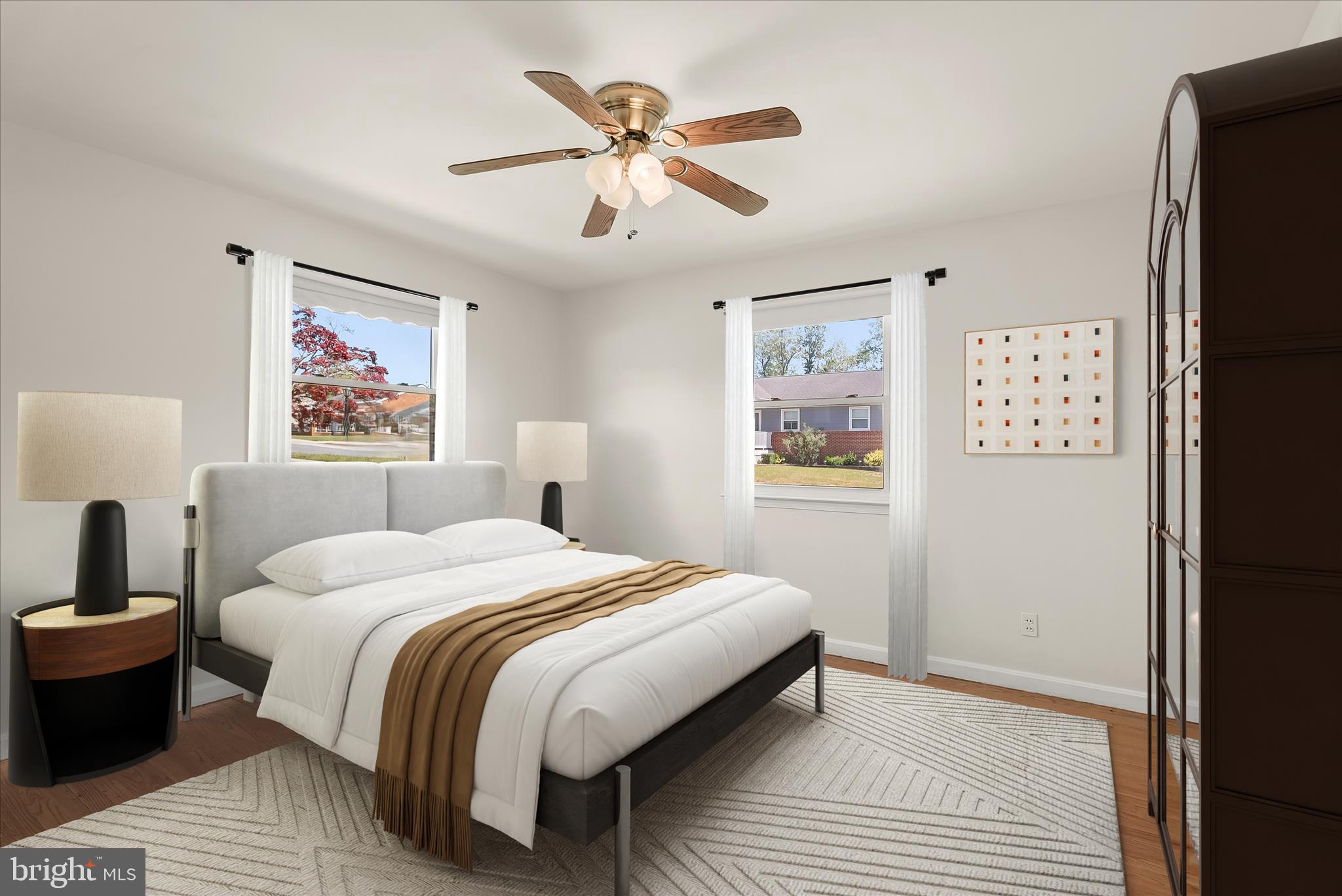 5810 Ritchie Street Glen Burnie, MD 21061 - Photo 5 of 55 a bedroom with a large bed and a chandelier