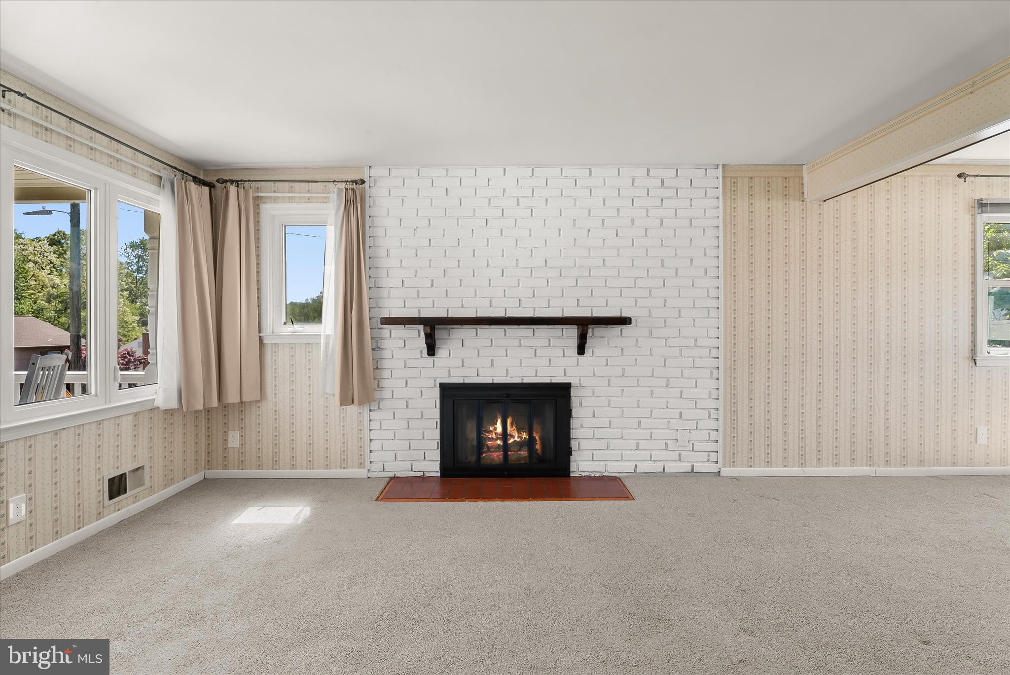 5810 Ritchie Street Glen Burnie, MD 21061 - Photo 9 of 55 a living room with furniture and a fireplace