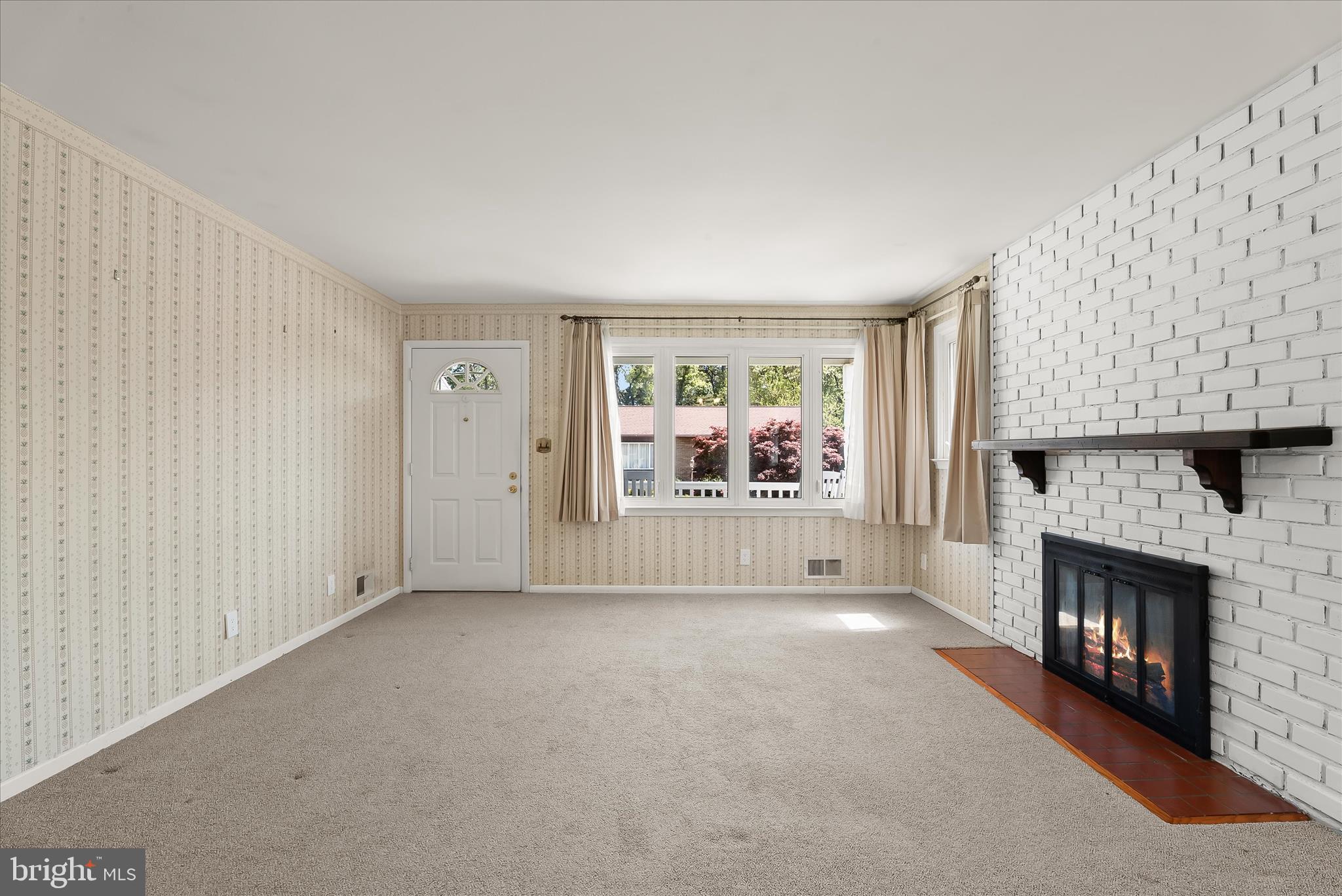 5810 Ritchie Street Glen Burnie, MD 21061 - Photo 10 of 55 a view of empty room with fireplace and fan