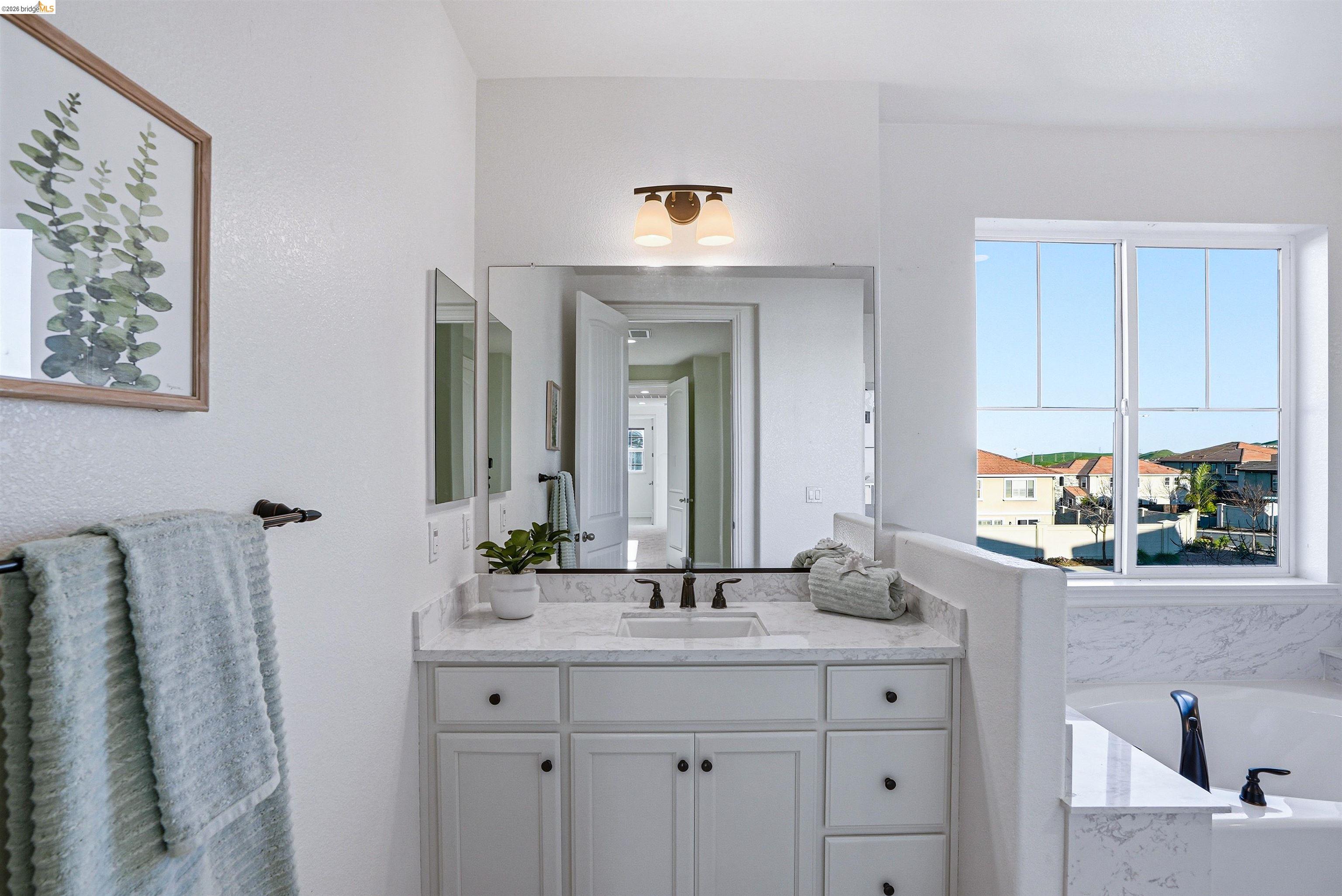 2525 Modena Drive Pittsburg, CA 94565 - Photo 19 of 34 a bathroom with a sink and a mirror