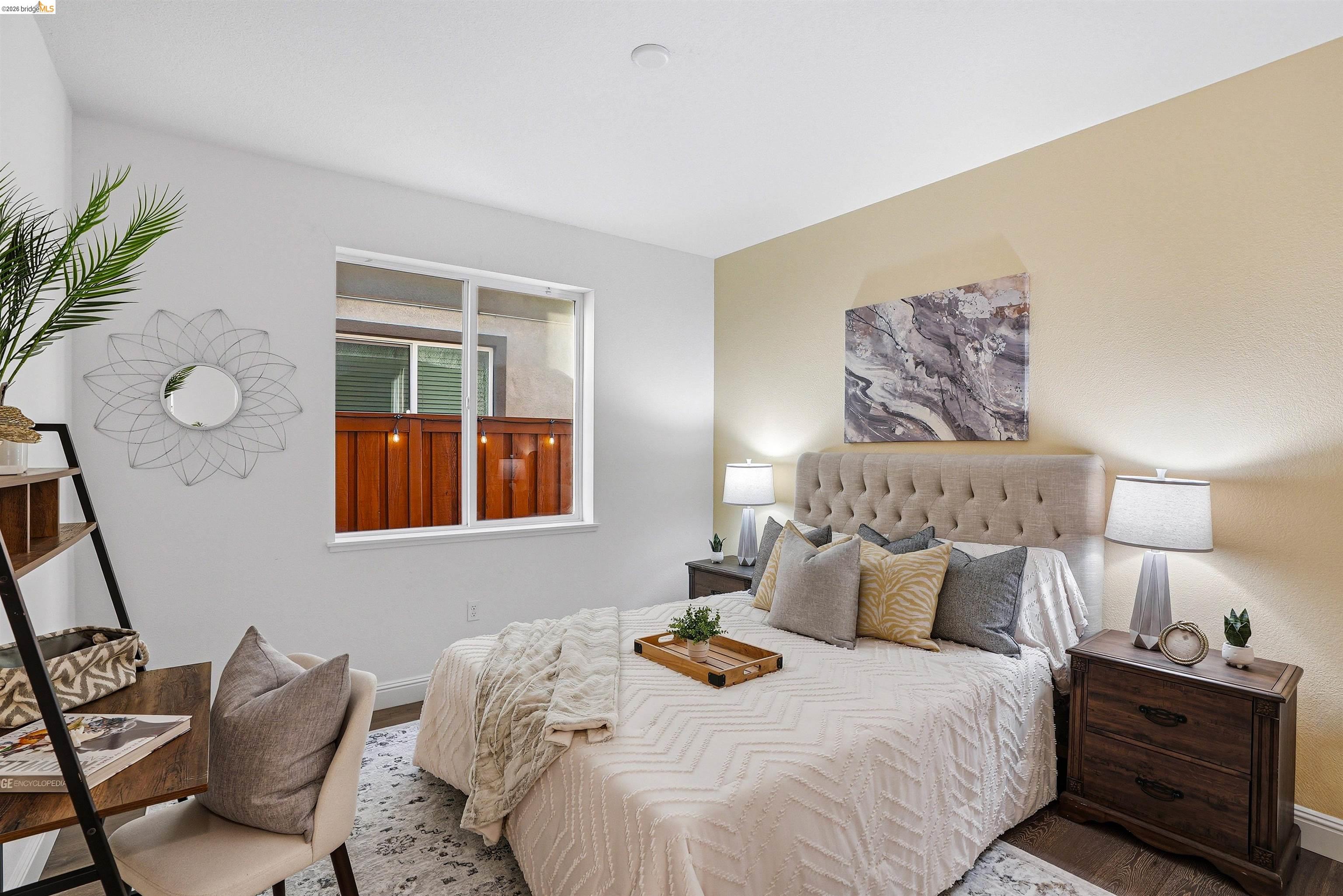 2525 Modena Drive Pittsburg, CA 94565 - Photo 21 of 34 a bedroom with bed and wooden floor