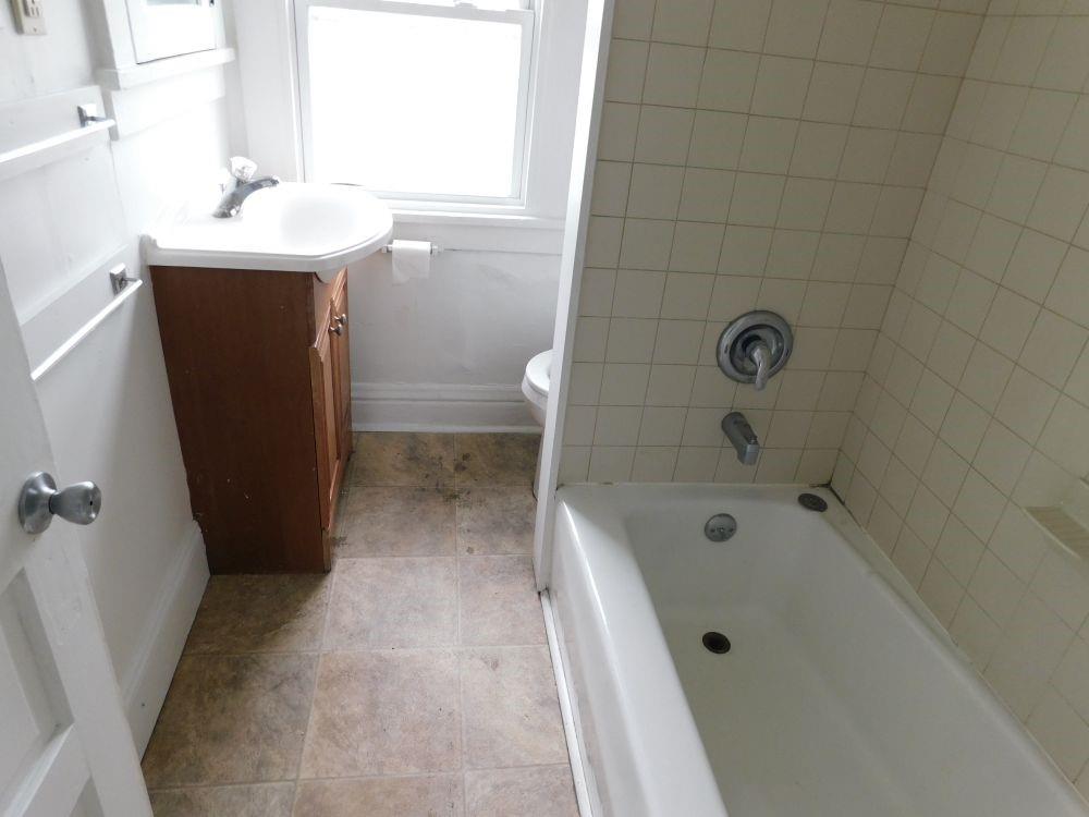 793 Baldwin Avenue Sharon, PA 16146 - Photo 4 of 7 a bathroom with a sink a toilet and shower