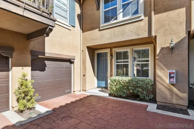 a view of a brick house with a large windows