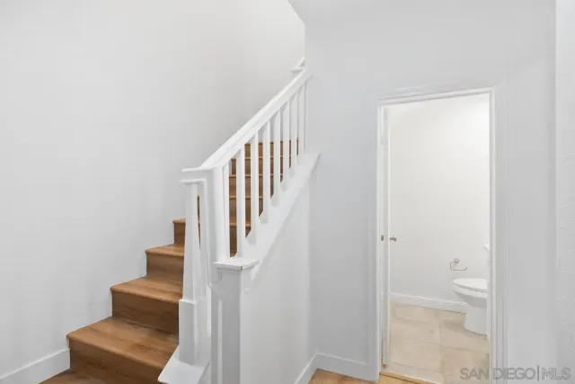 a view of entryway and hall with a rug