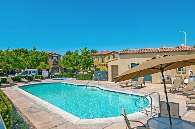 a view of a patio with swimming pool