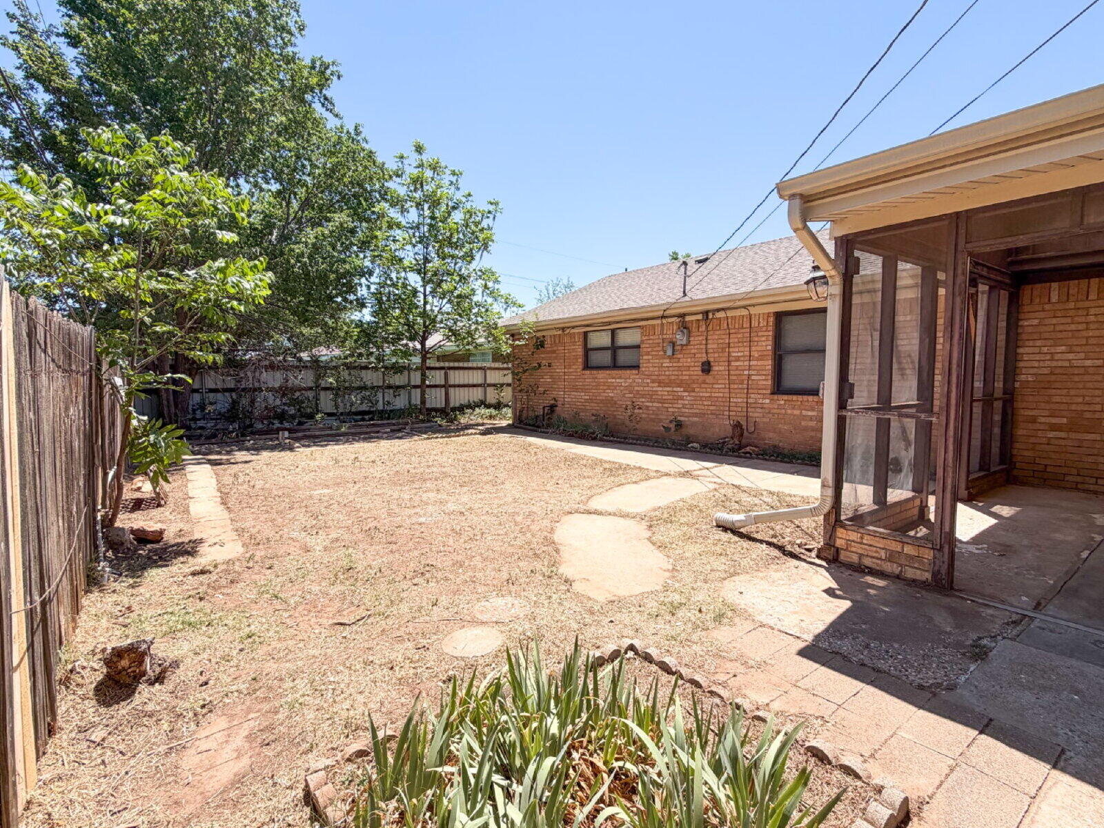 5604 38th Street Lubbock, TX 79407 - Photo 11 of 11 a view of a backyard of the house
