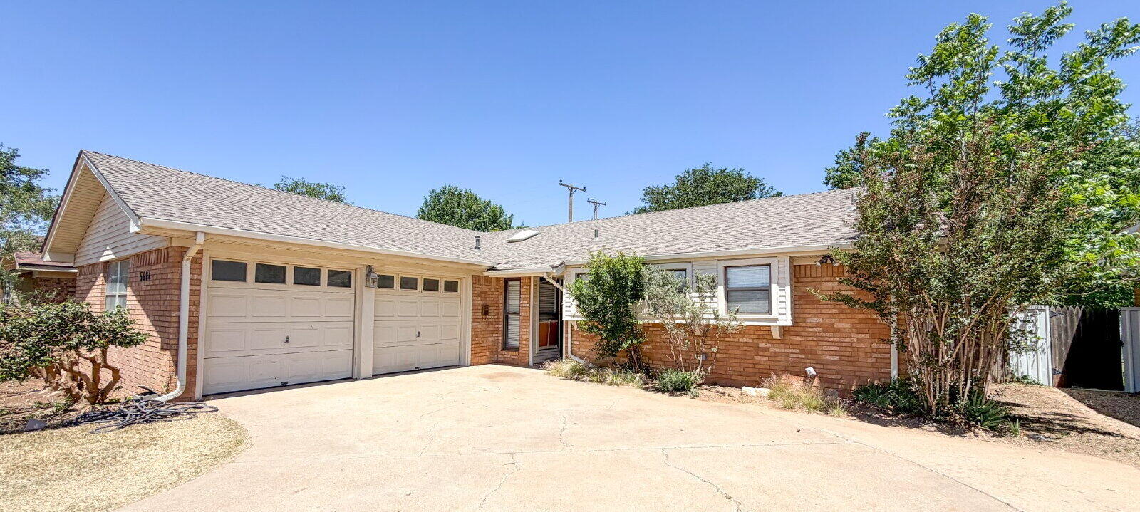 5604 38th Street Lubbock, TX 79407 - Photo 2 of 11 a view of a house with a yard