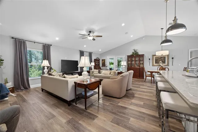 a large kitchen with a table and chairs in it